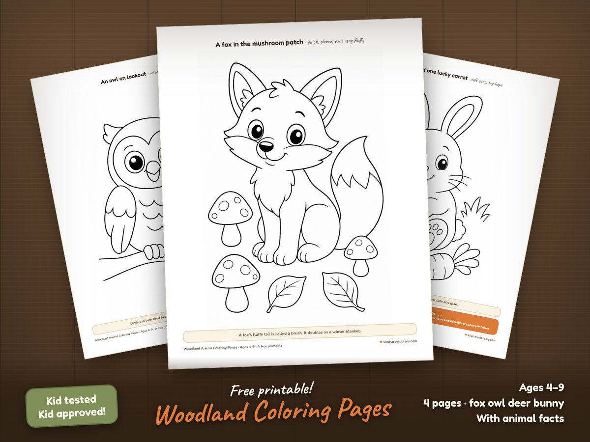 Woodland animal coloring pages fanned on a wooden table: a fox among mushrooms, an owl on a branch, a spotted fawn in flowers, and a bunny with a carrot